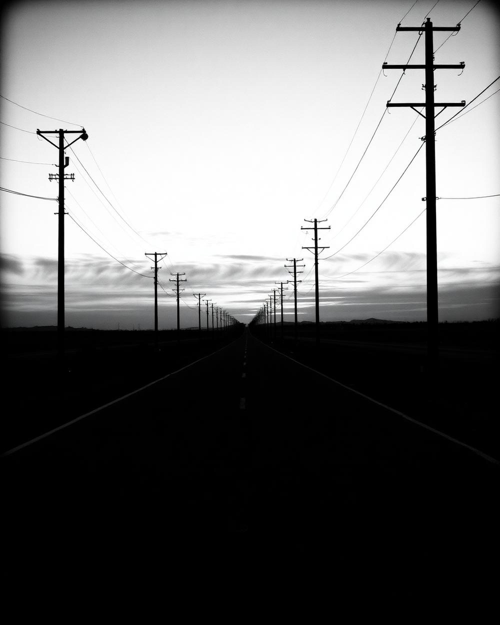 A long empty highway stretching to the horizon, a career built one mile at a time.
