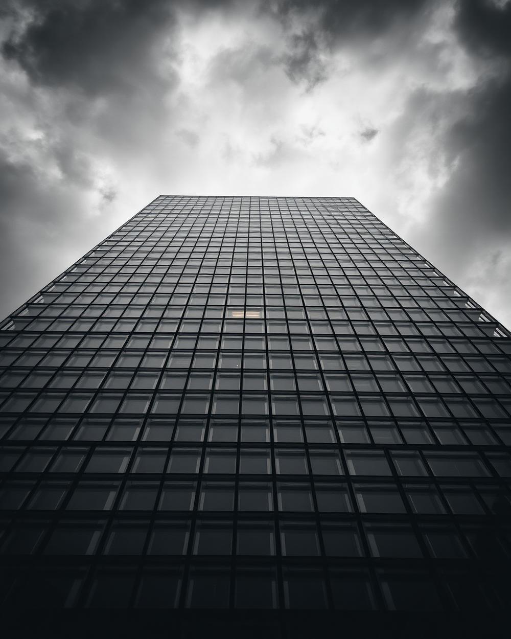 Modernist glass skyscraper, real teams, real constraints, real outcomes.